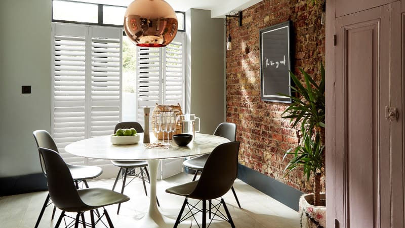 tracked shutters in dining room