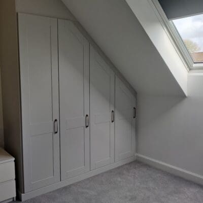fitted wardrobe in sloping ceiling alcove