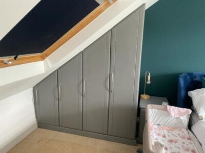 Fitted wardrobe under sloped ceiling