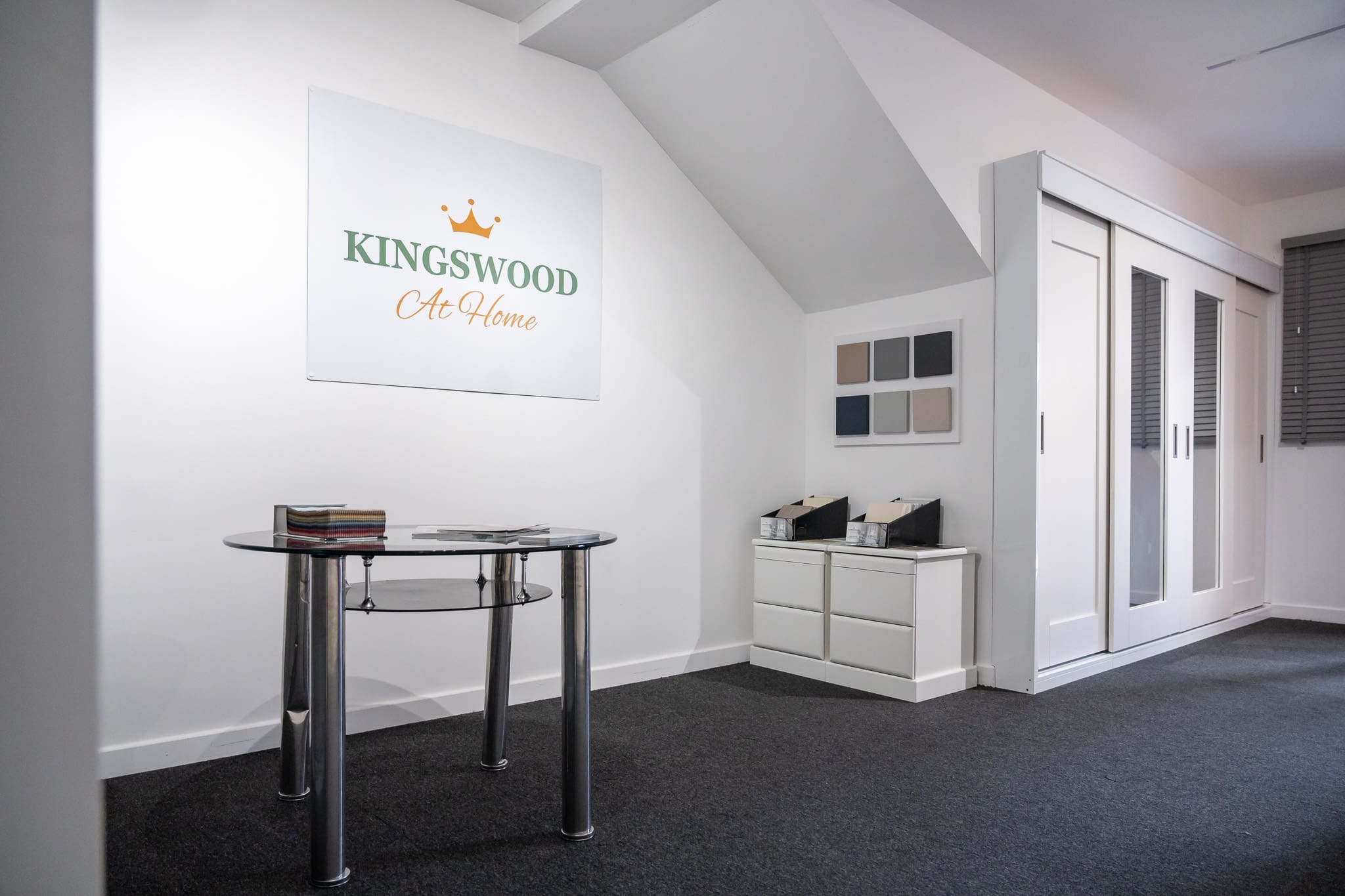 Kingswood showroom with sample materials and a fitted wardrobe