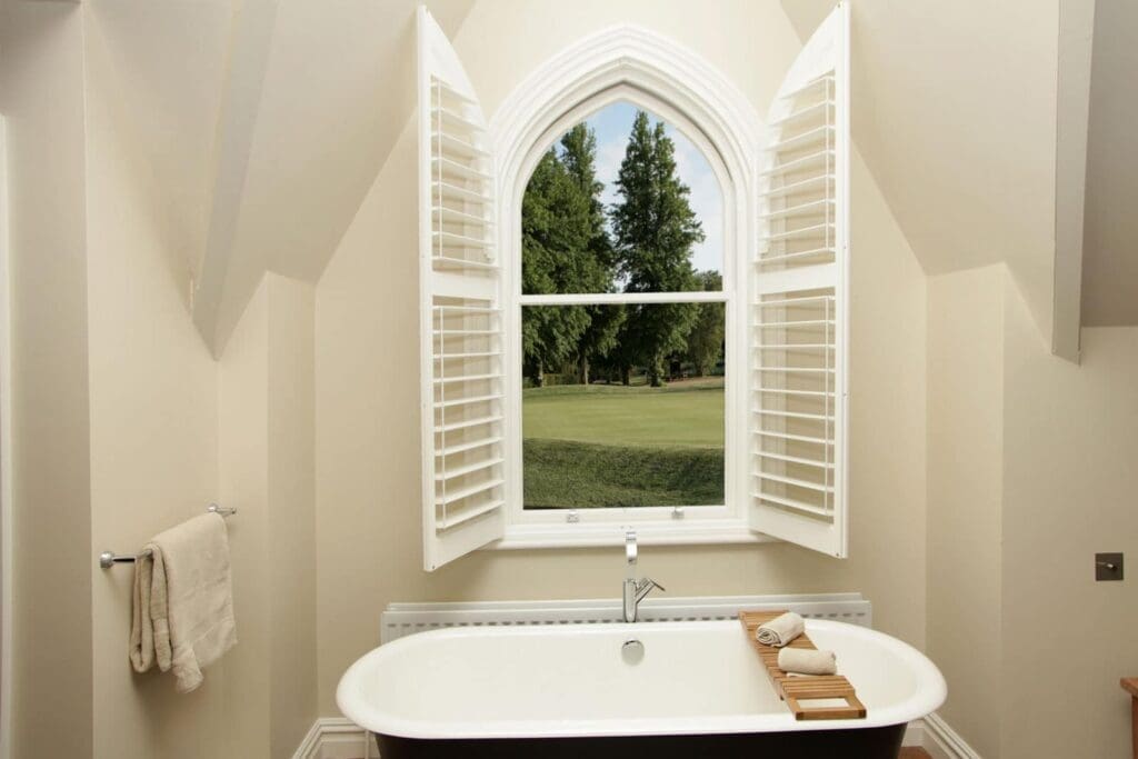 shaped shutters in bathroom