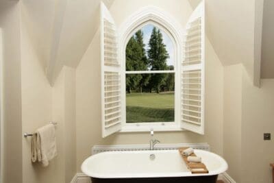 shaped shutters in bathroom