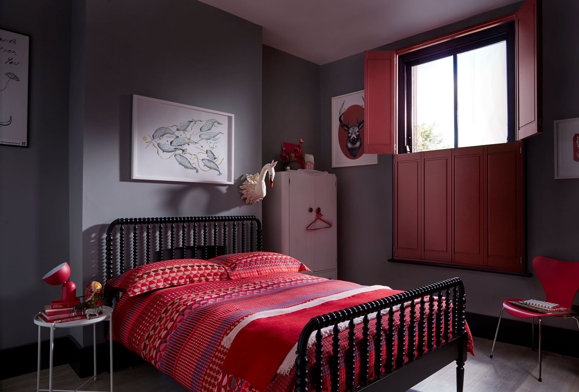 Red solid shutters in bedroom