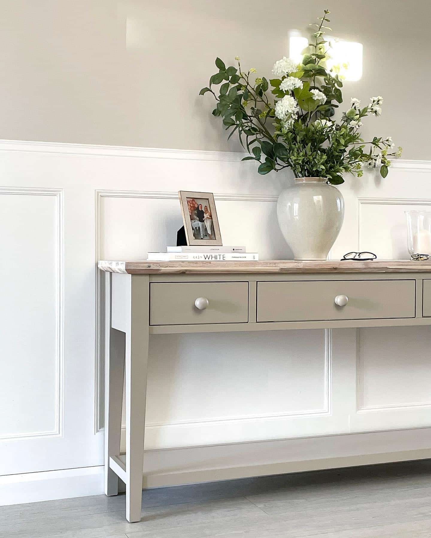 White wall panelling in a hallway