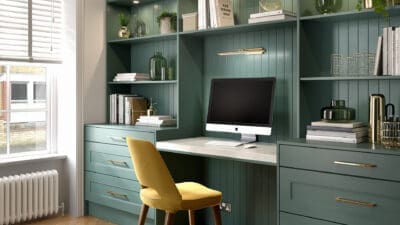 Green home office fitted storage with gold accents
