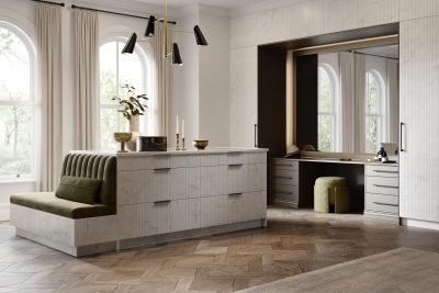White and grey marble fluted fitted storage in a dressing room