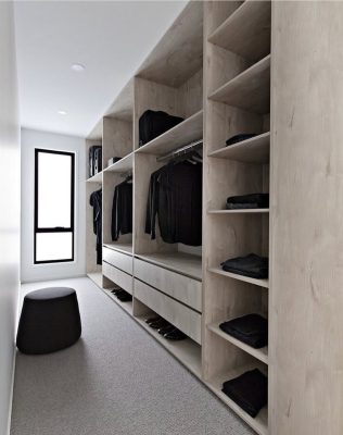 walkin wardrobe on one side in light wood